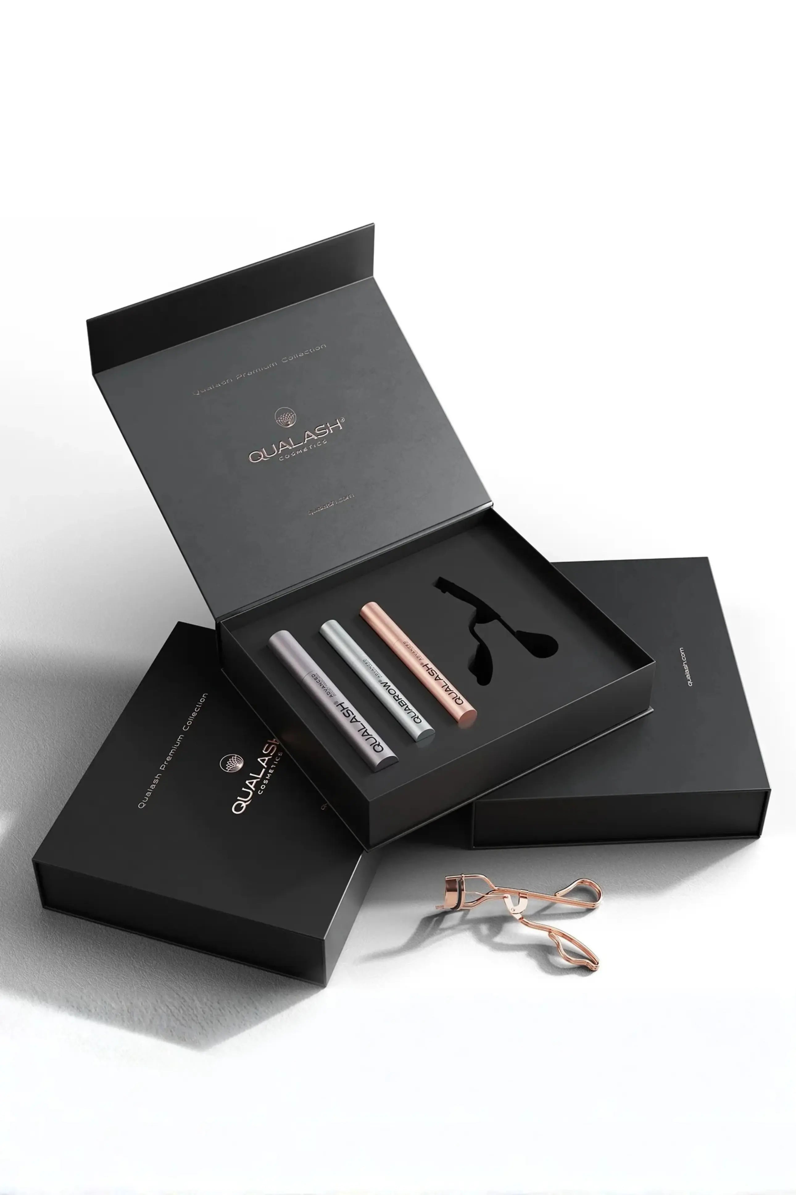 Stylish lifestyle photo of Qualash Premium Collection with curler and product packaging
